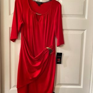 Dress with gold accent’s.  Never worn.